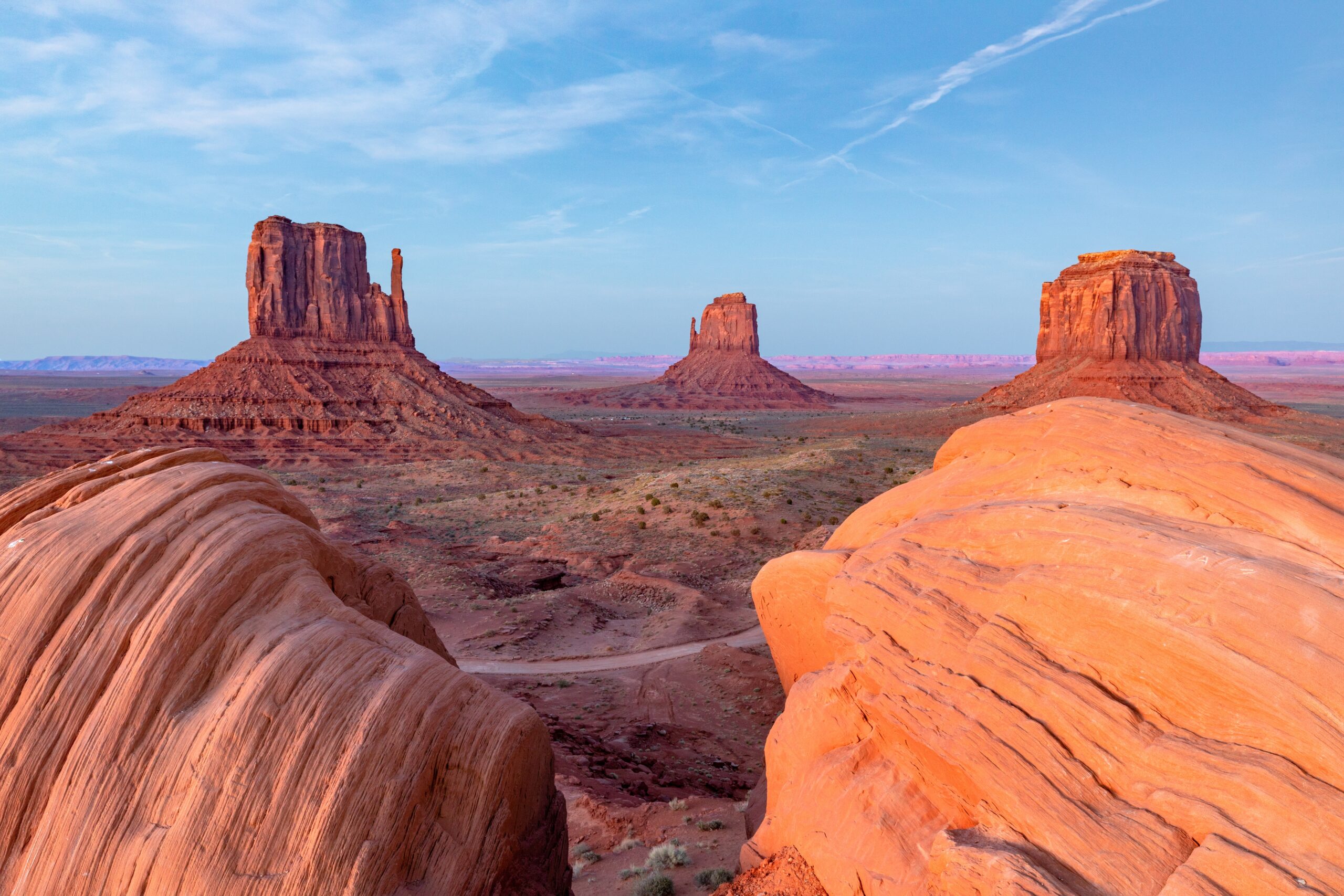 Monument Valley View of Mittens and Merrick Butte by red rocks